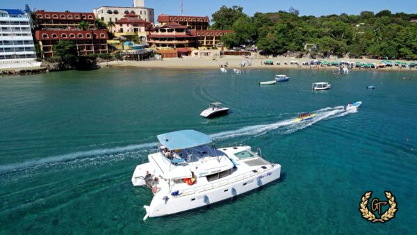 Fast boat speeding past the Sosua Catamaran cruise on a bright sunny day in Sosua beach.